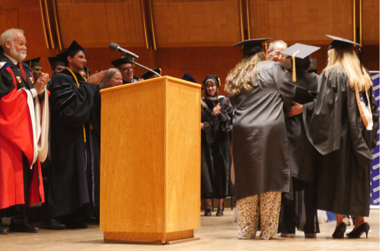 Shontae Ferguson, receives her diploma while in labor at graduation