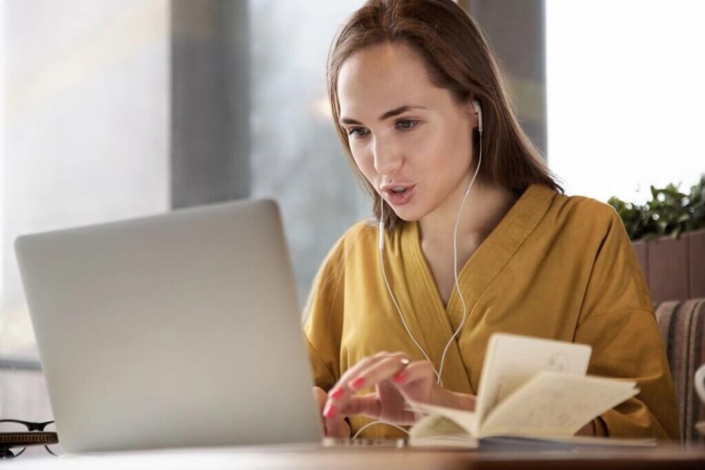 Woman working on a laptop.